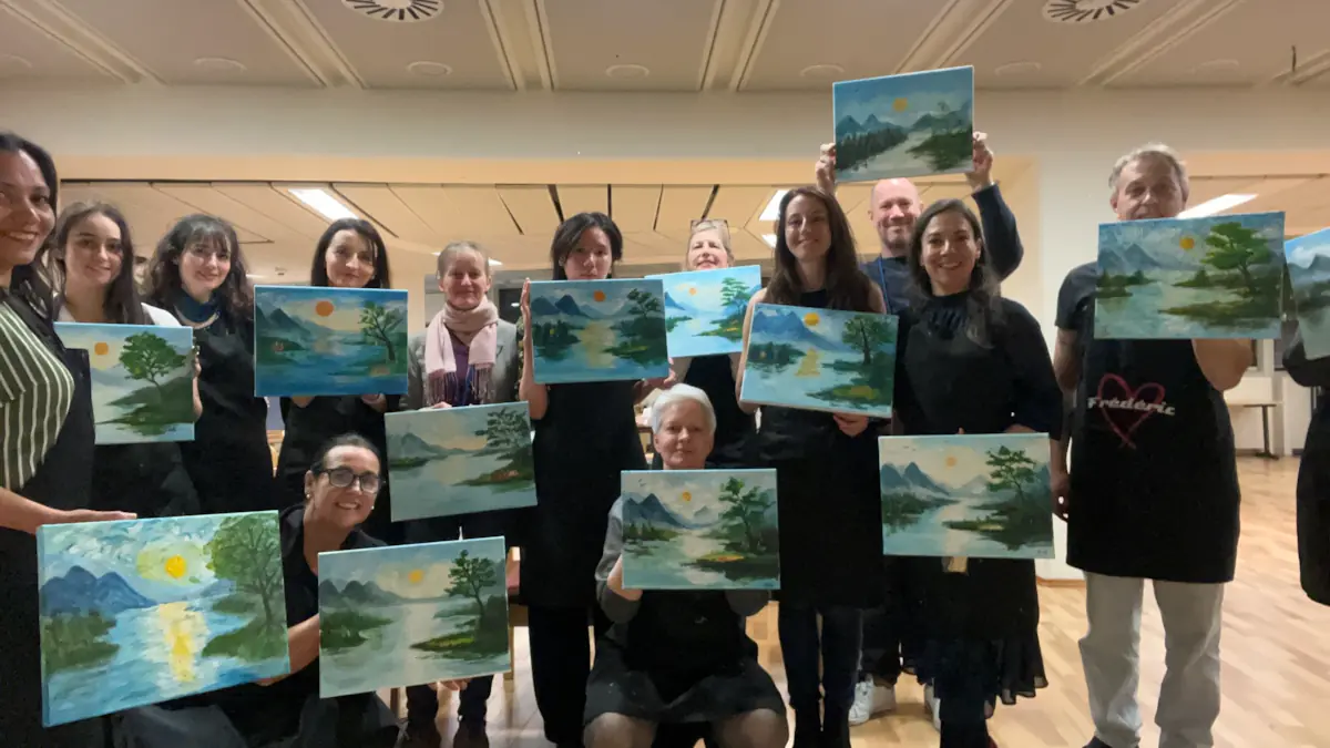 Participants showing their final artwork at VIC Health Club Art Night